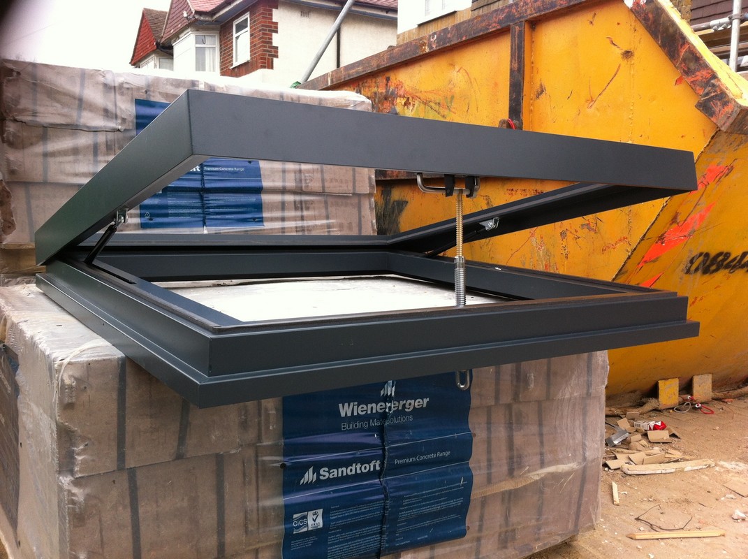 Opening flat roof skylight in anthracite grey installed in Waterloo