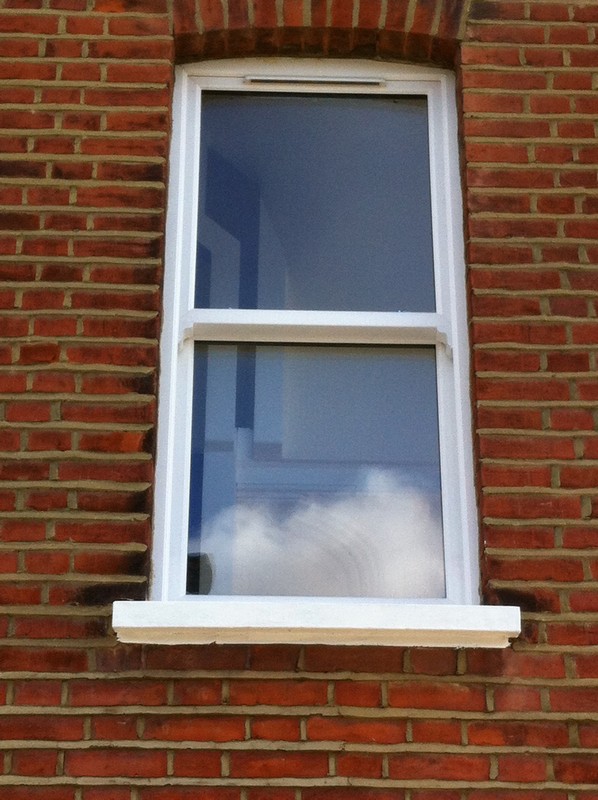 uPVC sash window on Victorian red brick house in Waterloo